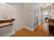 Bright hallway featuring hardwood floors and access to other rooms at 111 Autumn Dr, Longwood, FL 32779