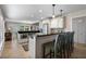 Stylish kitchen featuring white cabinets, stainless steel appliances, a breakfast bar, and tile flooring at 111 Autumn Dr, Longwood, FL 32779