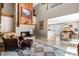 Cozy living room featuring a brick fireplace and an open floor plan leading into the dining area at 111 Autumn Dr, Longwood, FL 32779