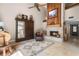 Living room featuring a fireplace, tile flooring, natural light, and high ceilings at 111 Autumn Dr, Longwood, FL 32779