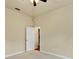 Bright bedroom featuring neutral walls, carpet, ceiling fan, and a door leading to another room at 1141 Sweet Heather Ln, Apopka, FL 32712