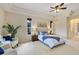 Bright main bedroom with tray ceilings, neutral tones, and outdoor access at 1141 Sweet Heather Ln, Apopka, FL 32712