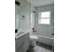 Stylish bathroom with white marble tile and modern fixtures at 11500 Brandiwine Ct, Clermont, FL 34711