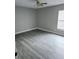 Neutral bedroom featuring ceiling fan, window, and hardwood flooring at 11500 Brandiwine Ct, Clermont, FL 34711