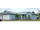 Charming one-story home with a two car garage, well-maintained lawn, and stylish architectural details at 11500 Brandiwine Ct, Clermont, FL 34711