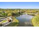 Breathtaking aerial view of the lush community lake featuring walking paths and gazebo at 11521 Camden Park Dr, Windermere, FL 34786