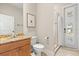 Bright bathroom featuring granite countertops, shower, and natural light at 11521 Camden Park Dr, Windermere, FL 34786