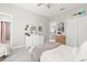 Bright bedroom with light gray walls and a large white dresser, and view to the hall at 11521 Camden Park Dr, Windermere, FL 34786