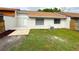 Exterior view of the home with a small patio area in the backyard at 142 Long Leaf Pine Cir, Sanford, FL 32773