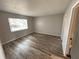 Empty bedroom with wood floor and window at 142 Long Leaf Pine Cir, Sanford, FL 32773