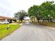 A residential street lined with mature trees and well-kept lawns enhances neighborhood charm at 142 Long Leaf Pine Cir, Sanford, FL 32773