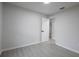 Grey room with white trim and flooring plus a white door leading to another room at 1497 Jay St, Longwood, FL 32750