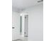 Hallway with white trim and doors leading to other rooms, plus light gray floors at 1497 Jay St, Longwood, FL 32750