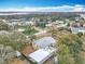 Expansive aerial shot capturing the property, the surrounding residential area, and scenic waterways in the distance at 1510 Live Oak St, New Smyrna Beach, FL 32168