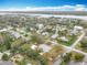 Wide aerial view of a neighborhood by the water on a sunny day at 1510 Live Oak St, New Smyrna Beach, FL 32168