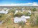 An aerial view of home showcasing the yard and proximity to neighborhood amenities at 1510 Live Oak St, New Smyrna Beach, FL 32168