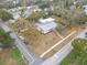 Aerial view of home showcasing the roof, landscaping, and surrounding neighborhood at 1510 Live Oak St, New Smyrna Beach, FL 32168