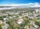 Majestic aerial view showcasing the property, neighborhood, and the vastness of the nearby waterway at 1510 Live Oak St, New Smyrna Beach, FL 32168