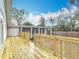 View of a recently constructed wood deck and a patio connected to the home at 1510 Live Oak St, New Smyrna Beach, FL 32168