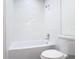 Bright bathroom featuring a bathtub with white subway tile at 1510 Live Oak St, New Smyrna Beach, FL 32168