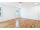 Bedroom featuring hardwood floors and natural light from windows at 1510 Live Oak St, New Smyrna Beach, FL 32168