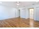 Bedroom featuring hardwood floors, natural light, and access to the bathroom at 1510 Live Oak St, New Smyrna Beach, FL 32168