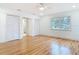 Bedroom featuring hardwood floors, natural light, and access to the bathroom at 1510 Live Oak St, New Smyrna Beach, FL 32168