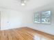 Bedroom featuring hardwood floors and a large window at 1510 Live Oak St, New Smyrna Beach, FL 32168