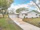 Beautiful single-story home with a two-car garage and lovely curb appeal with a metal roof at 1510 Live Oak St, New Smyrna Beach, FL 32168