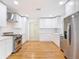 Spacious kitchen with stainless steel appliances, modern backsplash and white cabinets at 1510 Live Oak St, New Smyrna Beach, FL 32168