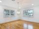 Living room featuring hardwood floors and natural light from front yard at 1510 Live Oak St, New Smyrna Beach, FL 32168