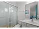 Bathroom featuring a glass shower, vanity, toilet, and view to bedroom at 1511 Fairview Cir, Kissimmee, FL 34747