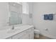 Clean, all white bathroom with walk in shower, toilet, and sink with drawers below at 1511 Fairview Cir, Kissimmee, FL 34747