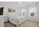 Spacious bedroom with natural light, neutral color palette, and comfortable bed at 1511 Fairview Cir, Kissimmee, FL 34747