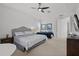 Spacious main bedroom featuring two beds, ceiling fan, and ample space at 1511 Fairview Cir, Kissimmee, FL 34747