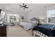 Spacious main bedroom with two beds, ceiling fan, lots of windows and natural light at 1511 Fairview Cir, Kissimmee, FL 34747