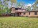 Picturesque backyard featuring a screened in porch and grassy area at 15523 Old Cheney Hwy, Orlando, FL 32828