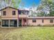 Large backyard featuring a mix of grassy areas and mature trees, offering a serene outdoor environment at 15523 Old Cheney Hwy, Orlando, FL 32828