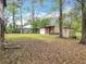 Spacious backyard with green grass and storage shed at 15523 Old Cheney Hwy, Orlando, FL 32828