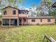 Beautiful backyard featuring a screened in porch and lush green grass at 15523 Old Cheney Hwy, Orlando, FL 32828