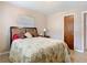 Bedroom featuring a bed, nightstand, lamp, and neutral wall color at 15523 Old Cheney Hwy, Orlando, FL 32828