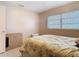 Bedroom with tile flooring, a bed, and windows with horizontal blinds at 15523 Old Cheney Hwy, Orlando, FL 32828