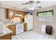 Cozy kitchen with white appliances and light wood cabinets at 15523 Old Cheney Hwy, Orlando, FL 32828