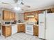 Cozy kitchen with white appliances and light wood cabinets at 15523 Old Cheney Hwy, Orlando, FL 32828