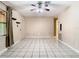 Open living room with tile floors and ceiling fan at 15523 Old Cheney Hwy, Orlando, FL 32828