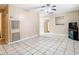 Open living room with tile floors and ceiling fan at 15523 Old Cheney Hwy, Orlando, FL 32828