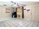 Open living room with tile floors and ceiling fan at 15523 Old Cheney Hwy, Orlando, FL 32828