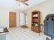 Home office with tile flooring and a bookshelf near a doorway at 15523 Old Cheney Hwy, Orlando, FL 32828