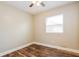 Bedroom with a ceiling fan, wood-look flooring, and bright natural light at 1582 Darlington Ave, Deltona, FL 32725