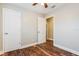 Bedroom showcasing wood-look flooring, white closet doors, and view of the hallway at 1582 Darlington Ave, Deltona, FL 32725